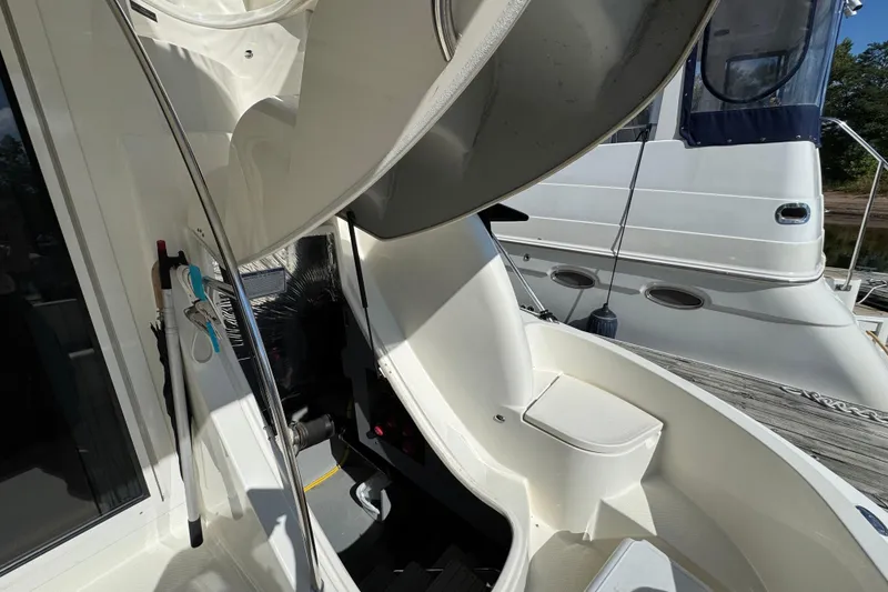 Slide: The Image of 2008 Meridian 391 Sedan yacht interior with open hatch and docked boat view. - 54