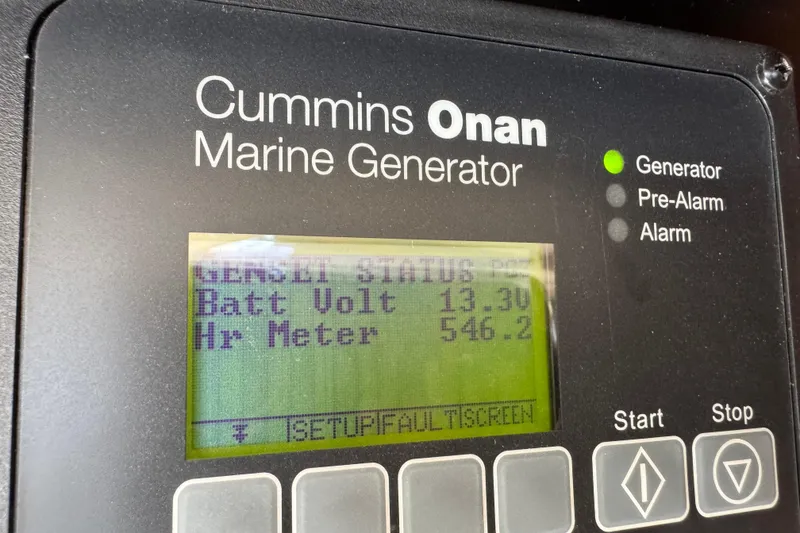 Slide: The Image of Cummins Onan marine generator display on 2008 Meridian 391 Sedan, showing battery voltage and hour meter. - 57