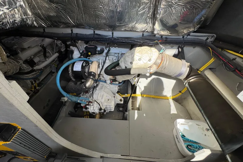 Slide: The Image of Engine compartment of a 2008 Meridian 391 Sedan boat, showcasing mechanical components. - 58