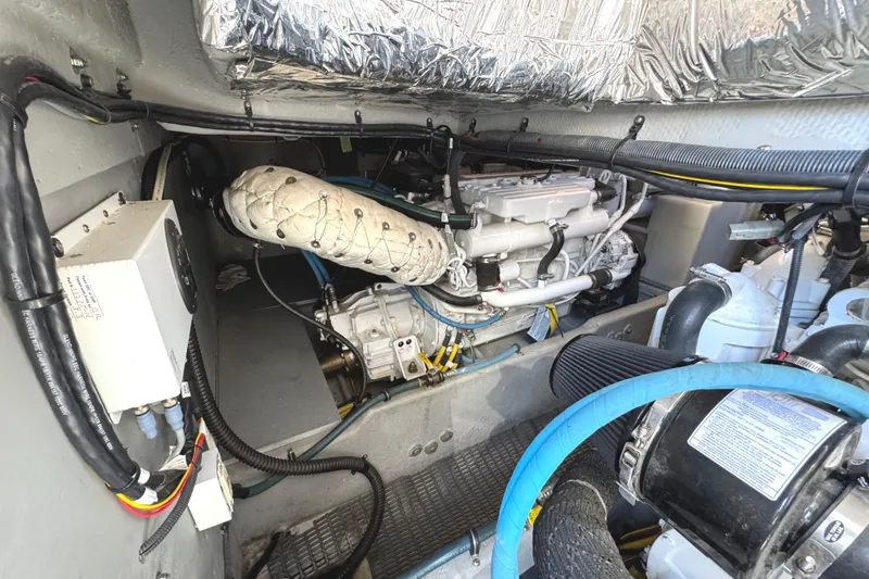 Slide: The Image of Engine room of a 2008 Meridian 391 Sedan yacht, showcasing mechanical components and wiring. - 60