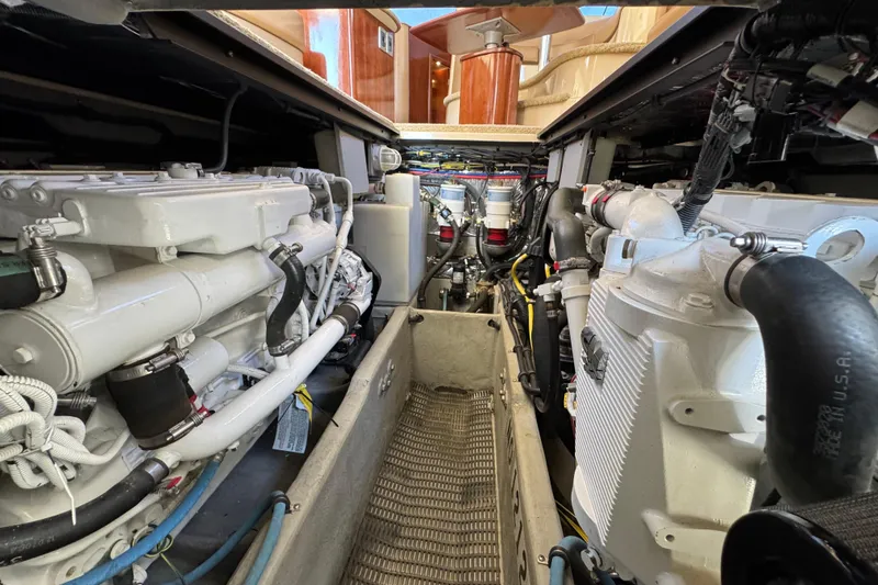 Slide: The Image of Engine room of a 2008 Meridian 391 Sedan yacht, showcasing dual engines and mechanical components. - 61