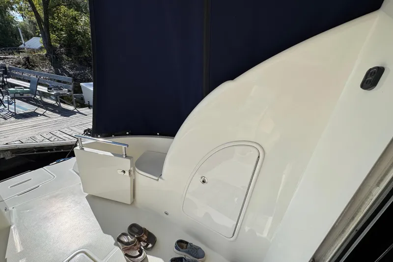 Slide: The Image of 2008 Meridian 391 Sedan yacht deck with seating and dock view. - 9