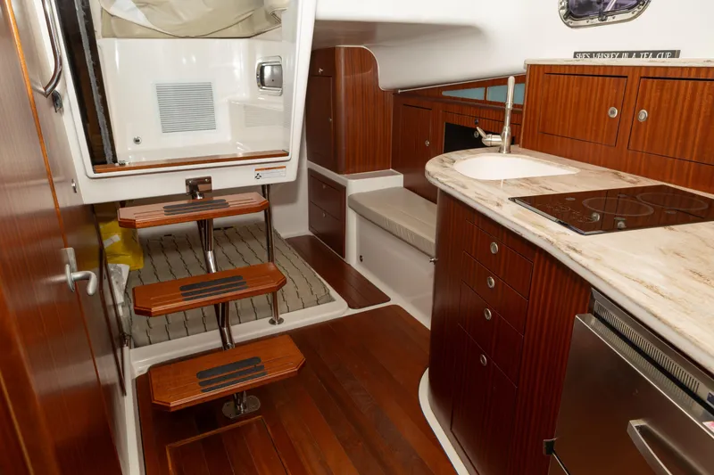 Slide: The Image of Pursuit 38 TRACKER - Cabin Entrance and Galley - 5