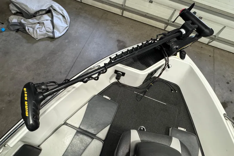 Slide: The Image of 2009 Lund 186 Tyee GL boat with Minn Kota trolling motor in garage. - 13