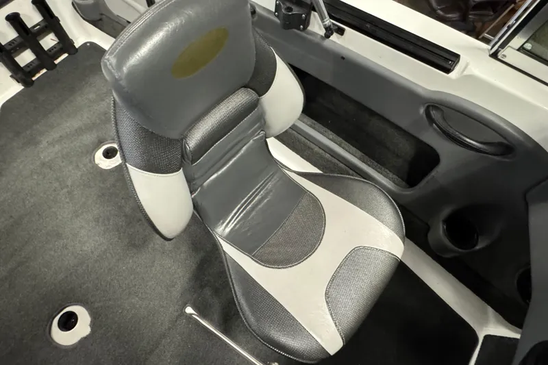 Slide: The Image of 2009 Lund 186 Tyee GL boat interior with gray and white cushioned seat. - 9