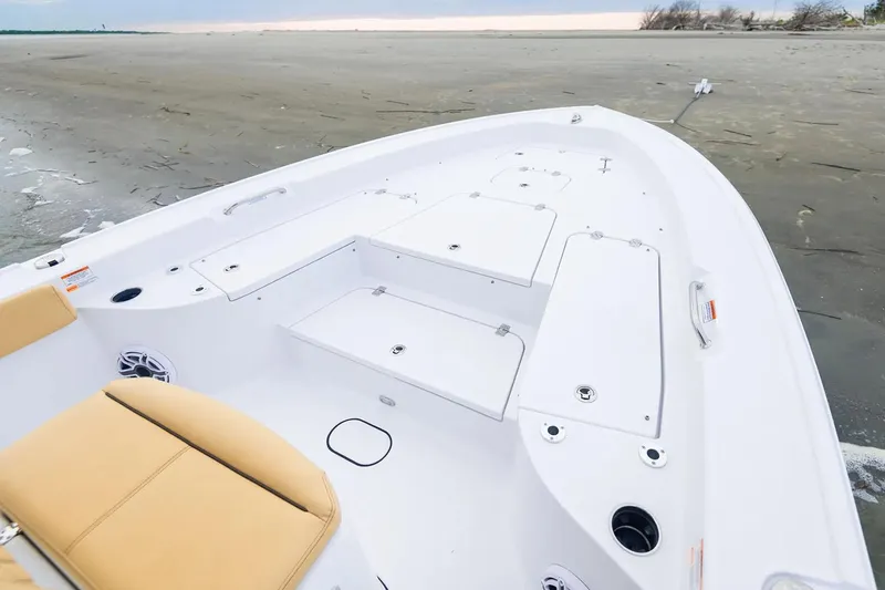 Slide: The Image of Manufacturer Provided Image: 2025 Sportsman Masters 267 Bay Boat with spacious deck and seating on a sandy shore. - 4