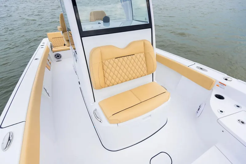 Slide: The Image of Manufacturer Provided Image: 2025 Sportsman Masters 267 Bay Boat with tan seating, sleek design on water. - 6