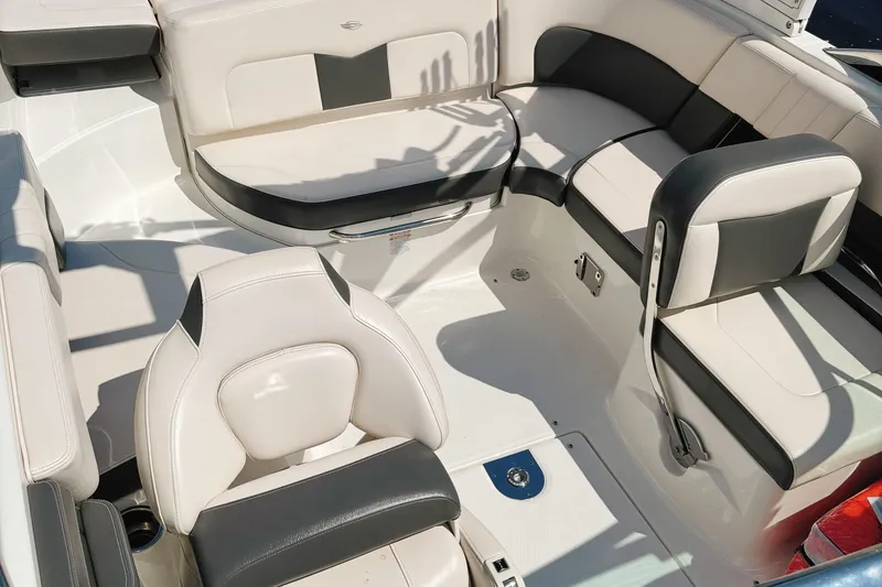 Slide: The Image of 2017 Chaparral 227 SSX boat interior with white and black seating arrangement. - 10