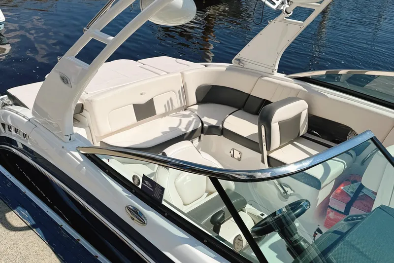 Slide: The Image of 2017 Chaparral 227 SSX boat interior with white seating and sleek design. - 13