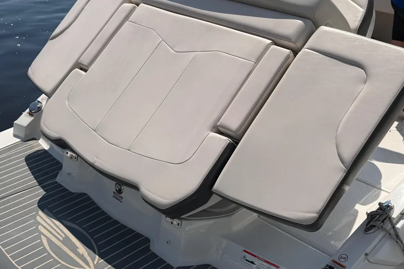 Slide: The Image of 2017 Chaparral 227 SSX boat with cushioned seating and sleek design. - 16