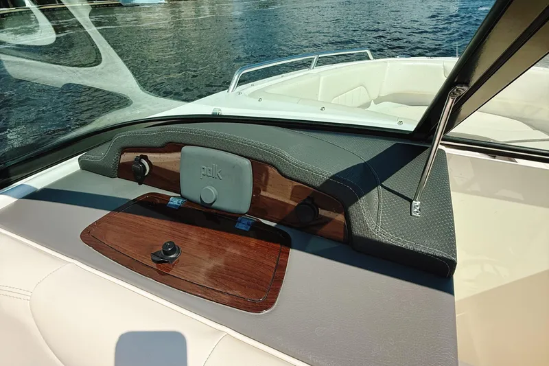 Slide: The Image of 2017 Chaparral 227 SSX boat dashboard with Polk audio system, on a sunny day. - 20