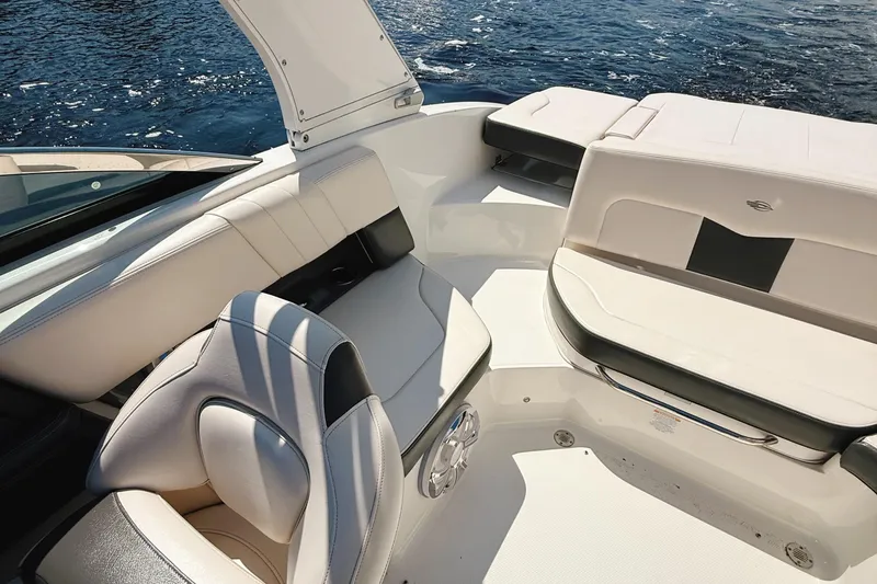 Slide: The Image of 2017 Chaparral 227 SSX boat interior with luxurious seating and water view. - 22
