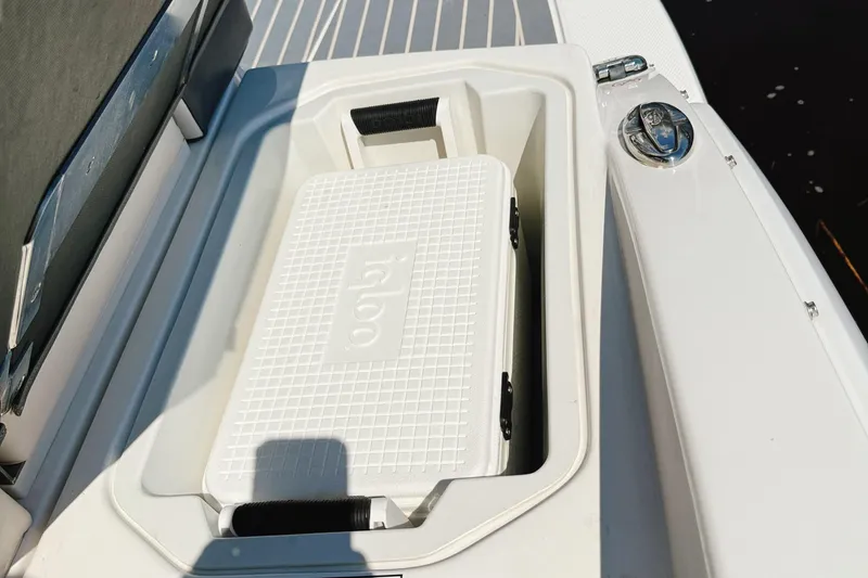 Slide: The Image of 2017 Chaparral 227 SSX boat with built-in Igloo cooler storage compartment. - 27
