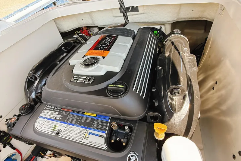 Slide: The Image of Engine compartment of 2017 Chaparral 227 SSX boat featuring a Mercury 4.5L 250 engine. - 29