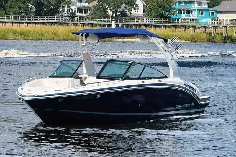 Slide: The Image of 2017 Chaparral 227 SSX boat cruising on a scenic waterway. - 3