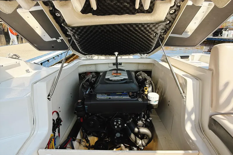 Slide: The Image of Engine compartment of a 2017 Chaparral 227 SSX boat with open hatch. - 30