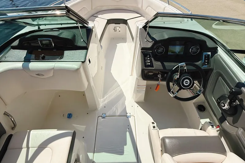Slide: The Image of 2017 Chaparral 227 SSX boat interior with steering wheel and dashboard. - 8