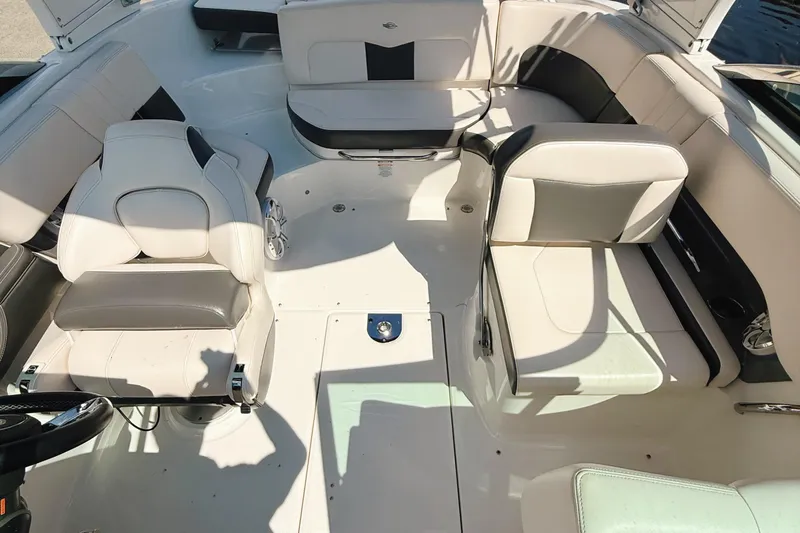 Slide: The Image of 2017 Chaparral 227 SSX boat interior with white and gray seating arrangement. - 9