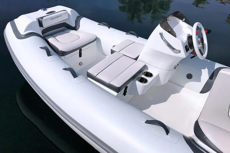 Slide: The Image of Manufacturer Provided Image: 2025 Walker Bay Generation 12 LTE boat interior with sleek seating and modern design. - 5