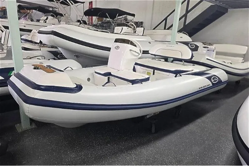 Slide: The Image of 2025 Walker Bay Generation 12 LTE boat with Yamaha 40HP, displayed in showroom. - 9