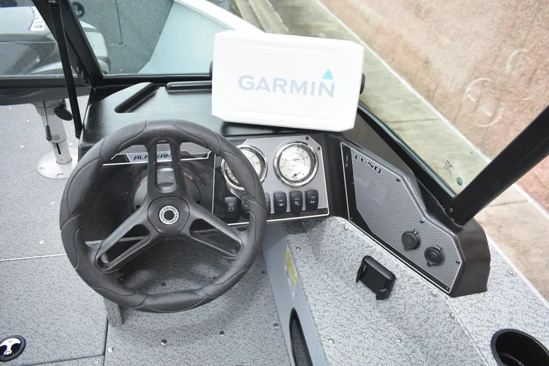 Slide: The Image of 2024 Lund 1875 Alaskan Sport boat dashboard with Garmin navigation system. - 12