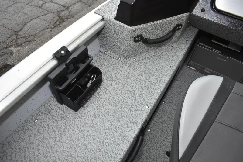 Slide: The Image of 2024 Lund 1875 Alaskan Sport interior with storage compartment and seating. - 15