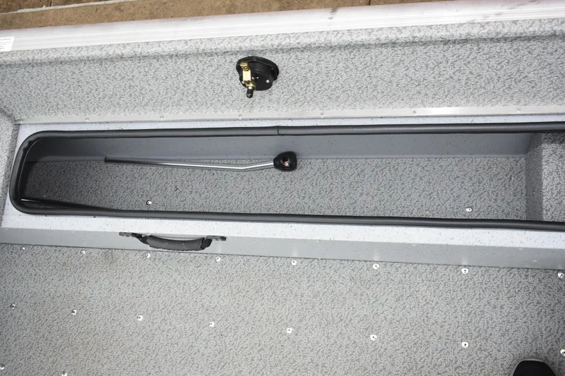 Slide: The Image of 2024 Lund 1875 Alaskan Sport boat interior storage compartment, featuring a sleek, durable design. - 17