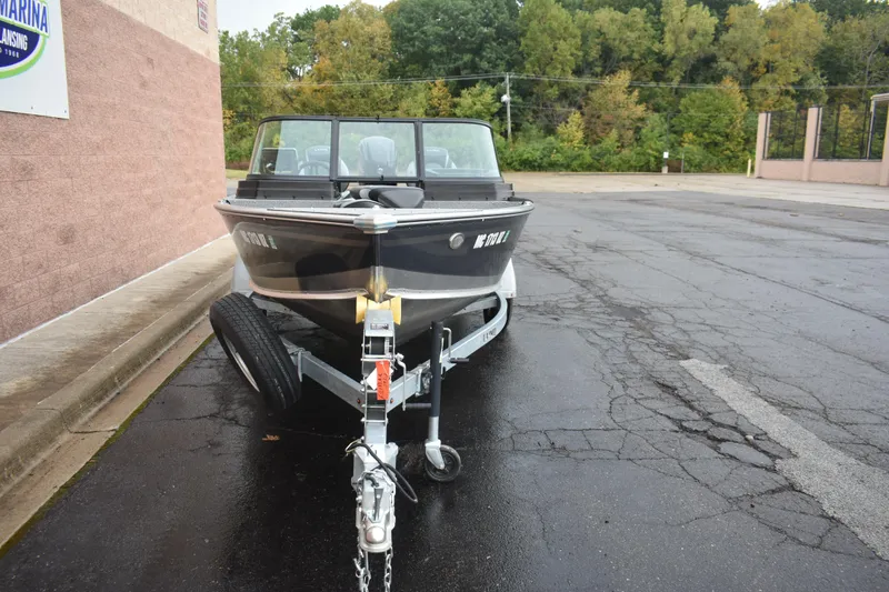 Slide: The Image of 2024 Lund 1875 Alaskan Sport boat on trailer, parked outdoors. - 6