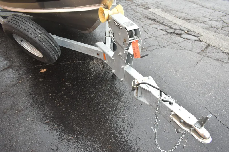 Slide: The Image of Trailer hitch of 2024 Lund 1875 Alaskan Sport on wet pavement. - 7