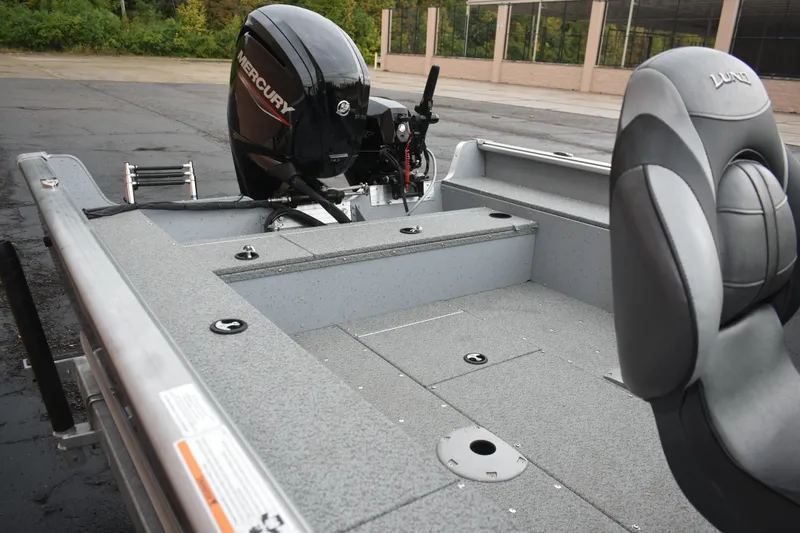 Slide: The Image of 2024 Lund 1875 Alaskan Sport boat interior with Mercury outboard motor. - 8
