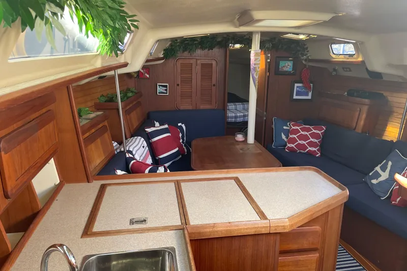 Slide: The Image of Interior of 1994 Hunter Legend 37.5 sailboat with cozy seating and nautical decor. - 12
