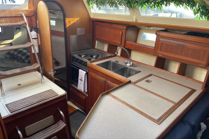Slide: The Image of Interior of 1994 Hunter Legend 37.5 sailboat with kitchen and sleeping area. - 13