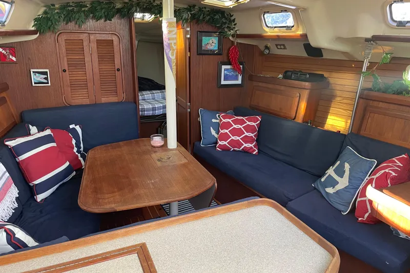 Slide: The Image of Cozy interior of 1994 Hunter Legend 37.5 sailboat with nautical-themed decor. - 14