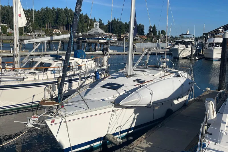 Slide: The Image of Sailboat docked at marina, 1994 Hunter Legend 37.5, surrounded by other boats. - 2