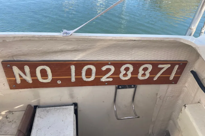 Slide: The Image of 1994 Hunter Legend 37.5 boat with registration number 1028871 displayed on wooden plaque. - 22