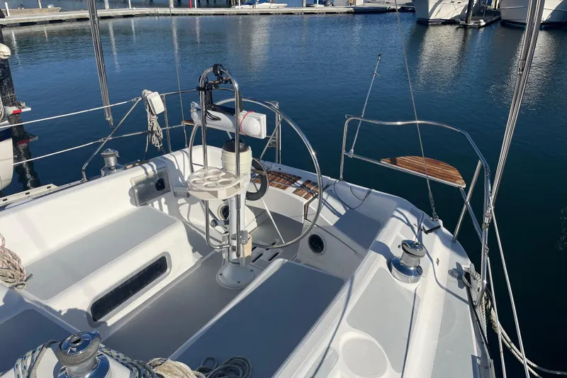 Slide: The Image of Cockpit of a 1994 Hunter Legend 37.5 sailboat docked at a marina. - 7