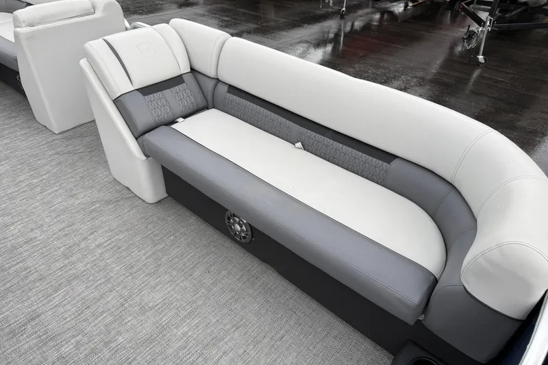Slide: The Image of Luxurious seating on 2022 Godfrey Sweetwater boat, featuring elegant gray and white upholstery. - 10