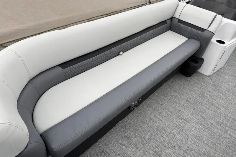 Slide: The Image of 2022 Godfrey Sweetwater boat interior with gray and white seating. - 12