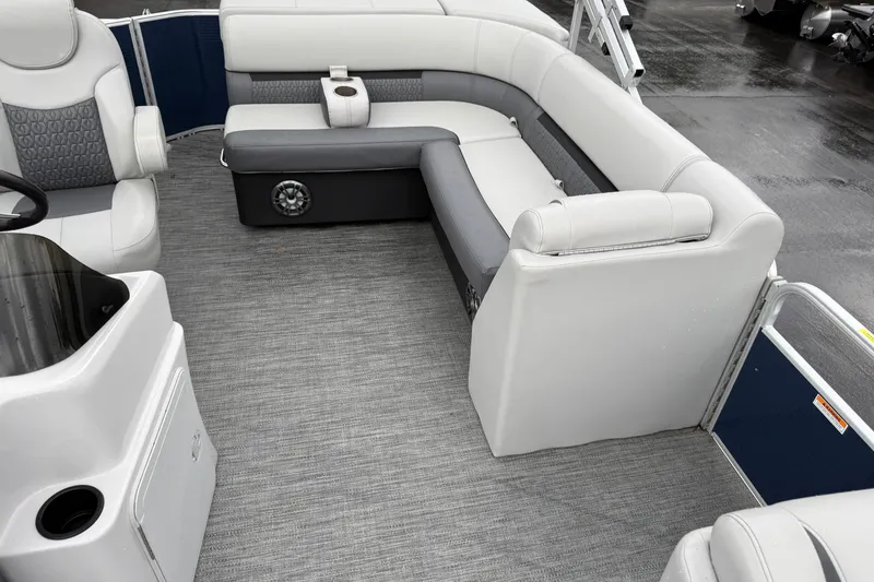 Slide: The Image of 2022 Godfrey Sweetwater boat interior with gray seating and carpeted flooring. - 14