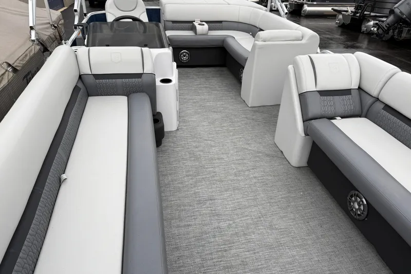 Slide: The Image of 2022 Godfrey Sweetwater boat interior with gray and white seating, spacious layout. - 8