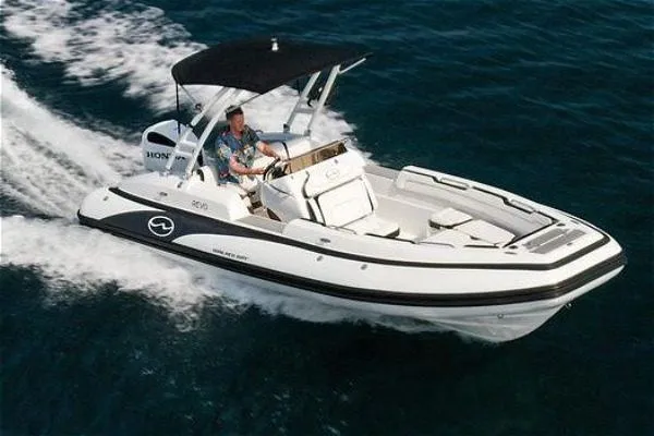 Slide: The Image of 2024 Walker Bay 22 boat cruising on open water, featuring sleek design and modern amenities. - 4