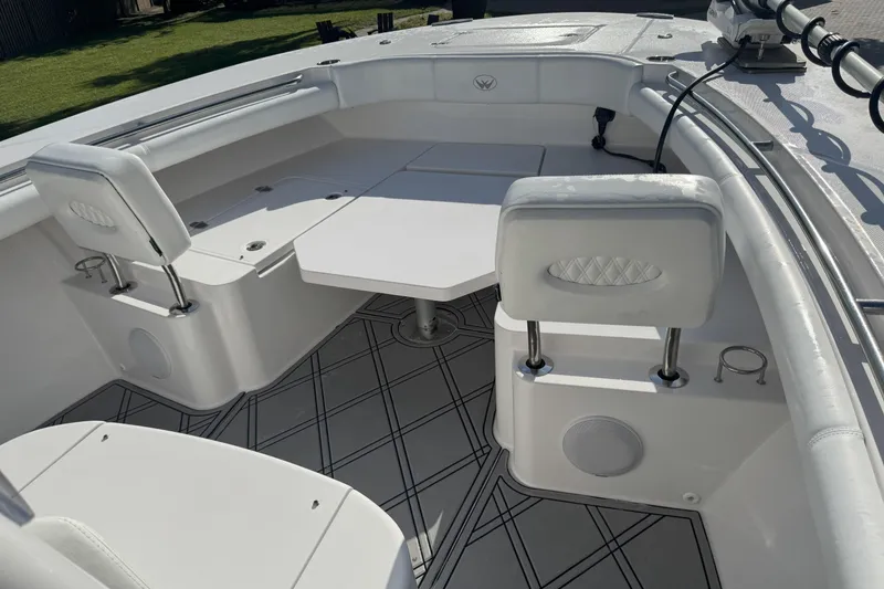 Slide: The Image of 2023 Southport 30 FE boat interior with seating and table, featuring modern design. - 10