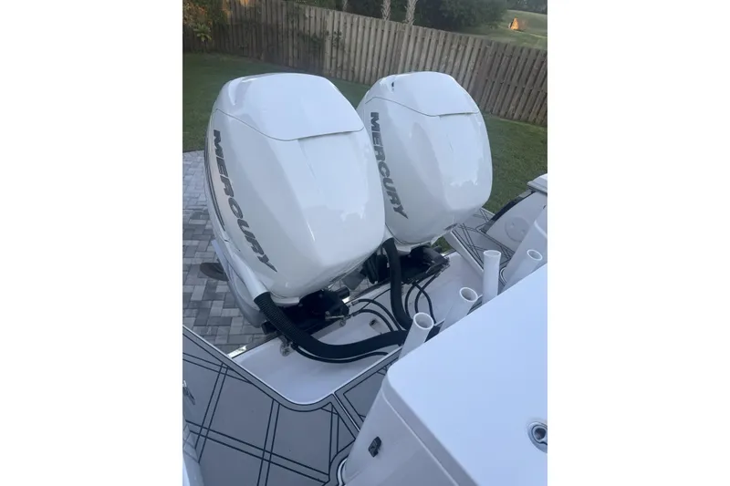 Slide: The Image of 2023 Southport 30 FE boat with dual Mercury outboard engines. - 3