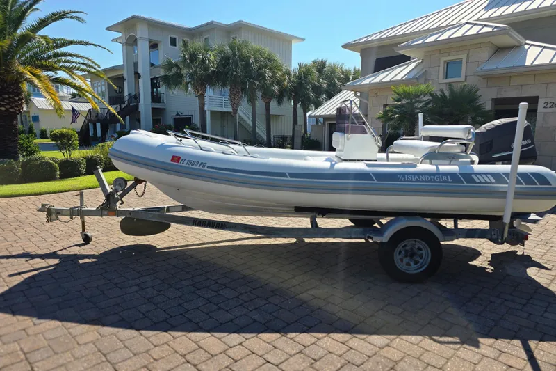 The Image of 2011 Novurania DL 550 boat floating on clear turquoise water. - 0