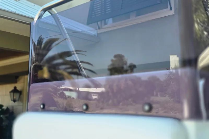 Slide: The Image of Steering wheel of 2011 Novurania DL 550 boat with control panel and compass. - 8