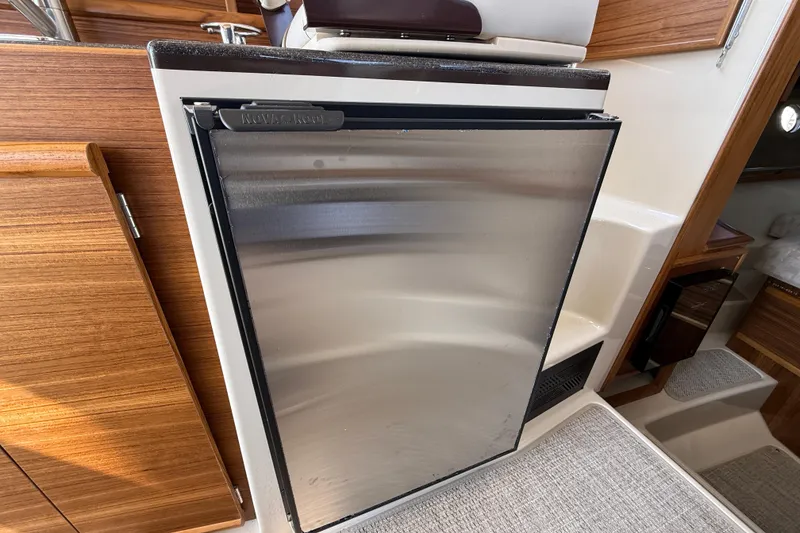 Slide: The Image of Compact stainless steel refrigerator in 2026 Ranger Tugs R-29 CB boat interior. - 16