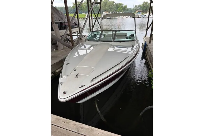 Slide: The Image of 2007 Formula 260 Sun Sport boat docked in a marina. - 4