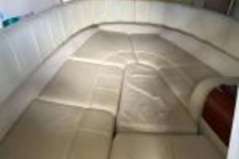 Slide: The Image of 2007 Formula 260 Sun Sport interior with beige leather seating. - 6