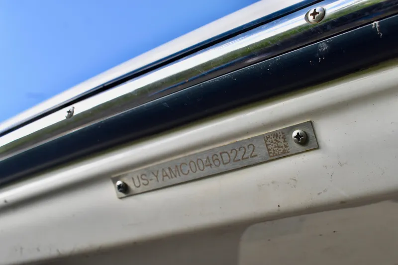 Slide: The Image of 2022 Yamaha Boats 252XE deck with logo and control panel. - 13