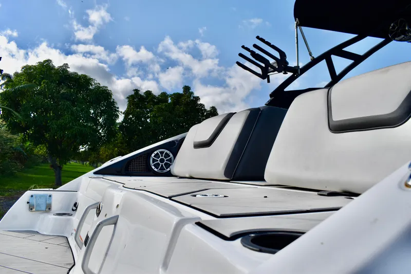 Slide: The Image of 2022 Yamaha Boats 252XE interior seating with sleek, modern design and comfortable cushions. - 18